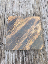 Fire Pit Art Crab Orchard stone base under a fire pit